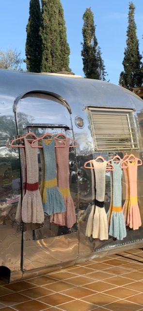 ecru mini dress, with racer back detail in red, and a red waistband, alpaca blend